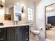 Bathroom featuring a dark vanity and view into the bedroom at 2125 Pine Dr, Raleigh, NC 27608
