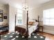 Bedroom featuring a four-poster bed and hardwood floors at 2125 Pine Dr, Raleigh, NC 27608