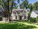 Charming home with a manicured lawn, mature trees, and a classic brick facade at 2125 Pine Dr, Raleigh, NC 27608