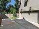 Attached two-car garage with a paved driveway and manicured landscaping at 2125 Pine Dr, Raleigh, NC 27608