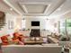 Spacious living room with cozy seating, fireplace, and elegant ceiling details at 2125 Pine Dr, Raleigh, NC 27608