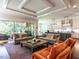 Bright, open-concept living room with tray ceiling, hardwood floors, and sliding doors to the outside at 2125 Pine Dr, Raleigh, NC 27608