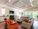 Bright and inviting living room with shiplap walls, fireplace, and ample seating at 2125 Pine Dr, Raleigh, NC 27608