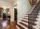 Staircase with wood treads and iron railings, showcasing the home's architectural details at 2125 Pine Dr, Raleigh, NC 27608