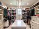 Walk-in closet features custom shelving, drawers, and an island at 2125 Pine Dr, Raleigh, NC 27608