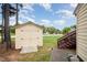 Backyard view featuring a storage shed and wooden stairs, great for extra storage at 220 Needle Park Dr, Cary, NC 27513