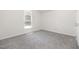 Carpeted bedroom featuring a large window that lets in plenty of natural light at 220 Needle Park Dr, Cary, NC 27513