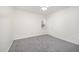 Cozy bedroom with carpet flooring, window views, and ceiling fan at 220 Needle Park Dr, Cary, NC 27513