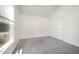 Bedroom featuring a vaulted ceiling, closet doors, carpet flooring, and a window at 220 Needle Park Dr, Cary, NC 27513