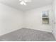 Comfortable bedroom with carpet, a ceiling fan, and a window at 220 Needle Park Dr, Cary, NC 27513