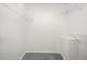 Walk-in closet with white walls, gray carpet, and wire shelving at 220 Needle Park Dr, Cary, NC 27513