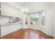 Eat-in dining area with hardwood floors and bright bay window at 220 Needle Park Dr, Cary, NC 27513