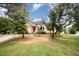Charming single-Gathering home with a red front door and well maintained lawn at 220 Needle Park Dr, Cary, NC 27513