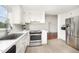 Updated kitchen with stainless steel appliances, plenty of cabinets, and quartz countertop at 220 Needle Park Dr, Cary, NC 27513