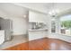 Bright kitchen features stainless steel appliances, hardwood floors, and great natural light at 220 Needle Park Dr, Cary, NC 27513