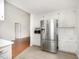 Bright kitchen features stainless steel appliances and white cabinets at 220 Needle Park Dr, Cary, NC 27513