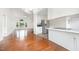 Spacious living room and kitchen with hardwood floors and natural lighting at 220 Needle Park Dr, Cary, NC 27513
