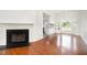 Spacious room with hardwood floors, fire place and lots of natural light at 220 Needle Park Dr, Cary, NC 27513