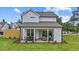 Spacious backyard featuring a covered patio, perfect for outdoor entertaining at 222 Faith Avenue, Sanford, NC 27330
