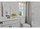 Bright bathroom featuring a vanity and a shower-tub combination at 222 Faith Avenue, Sanford, NC 27330