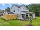 Backyard with a well-manicured lawn, fenced yard and cozy covered patio at 222 Faith Avenue, Sanford, NC 27330
