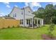 Exterior shows a well-maintained home with a cozy patio and lush green lawn at 222 Faith Avenue, Sanford, NC 27330