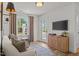 Inviting living room featuring a comfy sofa, TV, stylish cabinet and natural light at 222 Faith Avenue, Sanford, NC 27330