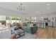 Spacious living room seamlessly flows into the modern kitchen with ample sunlight at 222 Faith Avenue, Sanford, NC 27330