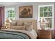 Serene main bedroom featuring a comfortable bed, soft lighting, and picturesque views at 222 Faith Avenue, Sanford, NC 27330