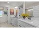 Bright bathroom with double sink vanity and white cabinetry at 223 Faith Avenue, Sanford, NC 27330