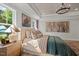 Serene bedroom featuring tray ceiling, art, and abundant natural light at 223 Faith Avenue, Sanford, NC 27330