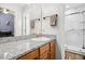 Bathroom with a granite countertop vanity, white sink, and glass enclosed shower at 229 White Oak Farm Dr, Willow Springs, NC 27592
