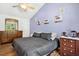 Cozy bedroom featuring a comfortable bed, stylish decor, and natural light, creating a serene retreat at 229 White Oak Farm Dr, Willow Springs, NC 27592
