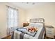 Bedroom with natural light, neutral walls, and minimalist decor create a serene retreat at 229 White Oak Farm Dr, Willow Springs, NC 27592