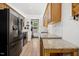 Contemporary kitchen boasting stainless steel appliances, granite countertops, and ample cabinetry for storage at 229 White Oak Farm Dr, Willow Springs, NC 27592
