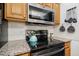 Modern kitchen features stainless steel appliances, granite countertops, and updated fixtures for cooking at 229 White Oak Farm Dr, Willow Springs, NC 27592