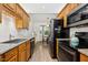 Well-equipped kitchen with granite countertops, modern appliances, and ample cabinet space for storage at 229 White Oak Farm Dr, Willow Springs, NC 27592