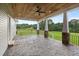 Spacious back porch with a stone floor, columns, wood ceilings and views of the yard at 2493 Nc-242, Benson, NC 27504