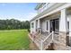 Well-maintained backyard and stone stairs leading to the rear entry featuring a lake view at 2493 Nc-242, Benson, NC 27504