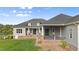 Home exterior with a rear patio, steps to the yard, and a view of the lake at 2493 Nc-242, Benson, NC 27504
