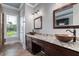 Bathroom features dual copper sinks, dark wood cabinets, and natural light creating a luxurious space at 2493 Nc-242, Benson, NC 27504