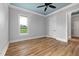 Bedroom featuring luxury vinyl flooring and a large window letting in natural light at 2493 Nc-242, Benson, NC 27504