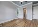 Spacious bedroom with hardwood floors and a view into the bathroom and shower at 2493 Nc-242, Benson, NC 27504