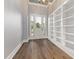 Welcoming foyer with hardwood floors, built-in shelving, and bright natural light at 2493 Nc-242, Benson, NC 27504