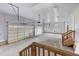 Spacious three car garage features white doors and stairs to an upper level at 2493 Nc-242, Benson, NC 27504