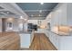 Bright kitchen with white cabinetry, granite counters, and a center island at 2493 Nc-242, Benson, NC 27504