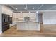 Modern kitchen with white cabinets, granite countertops, and a spacious island at 2493 Nc-242, Benson, NC 27504