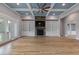 Bright living room boasts a stone fireplace, custom built-ins, and coffered ceiling at 2493 Nc-242, Benson, NC 27504