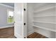 Pantry room with vinyl flooring and shelving for maximum storage of goods at 2493 Nc-242, Benson, NC 27504