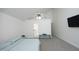 Large bedroom featuring carpeted floor, vaulted ceiling and tv at 25 Ruth Cir, Fuquay Varina, NC 27526
